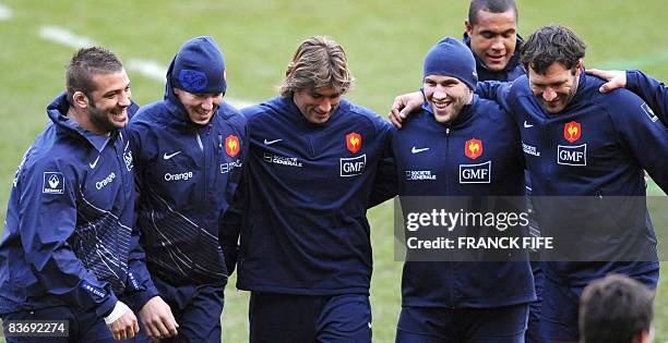France's prop Lionel Faure, flanker Imanol Harinordoquy, hooker Dimitri Szarzewski, Fabien Barcella and captain Lionel Nallet jokes during a training...