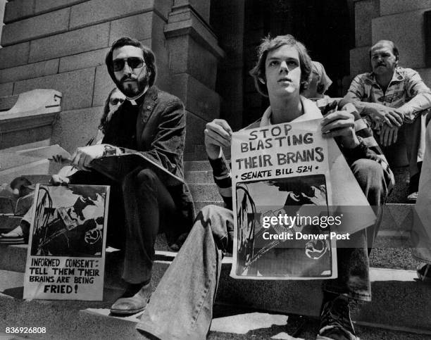 Convulsive-Treatment Bill Supported The Rev. Phillip Tunison, left, and Randy Keller sit on steps of the Capitol during a rally which began a...