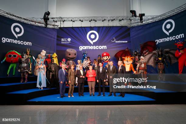 Sean Casey, Henriette Reker, Armin Laschet, Felix Falk, Tobias Haar and Gerald Boese welcome German Chancellor Angela Merkel at the Gamescom 2017...