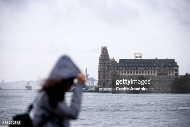 General view of the Haydarpasa Terminal is seen as the rain starts to become effective, Kadikoy district of Istanbul in Turkey on August 22, 2017....