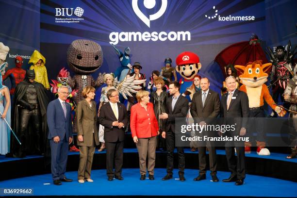 Sean Casey, Henriette Reker, Armin Laschet, Felix Falk, Tobias Haar and Gerald Boese welcome German Chancellor Angela Merkel at the Gamescom 2017...