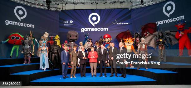 Sean Casey, Henriette Reker, Armin Laschet, Felix Falk, Tobias Haar and Gerald Boese welcome German Chancellor Angela Merkel at the Gamescom 2017...