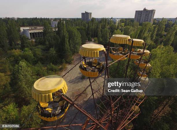 In this aerial view, a ferris wheel stands in the ghost town of Pripyat not far from the Chernobyl nuclear power plant on August 19, 2017 in Pripyat,...