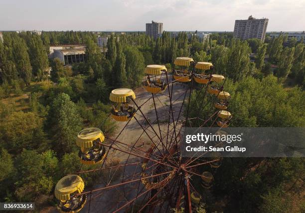 In this aerial view, a ferris wheel stands in the ghost town of Pripyat not far from the Chernobyl nuclear power plant on August 19, 2017 in Pripyat,...
