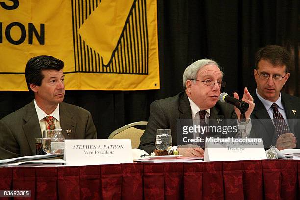 Treasurer Michael Karmatz addresses the audience while VP and 2008/2009 NJBA President Stephen Patron and 2007/2008 NJBA VP Thomas Critelli look on...