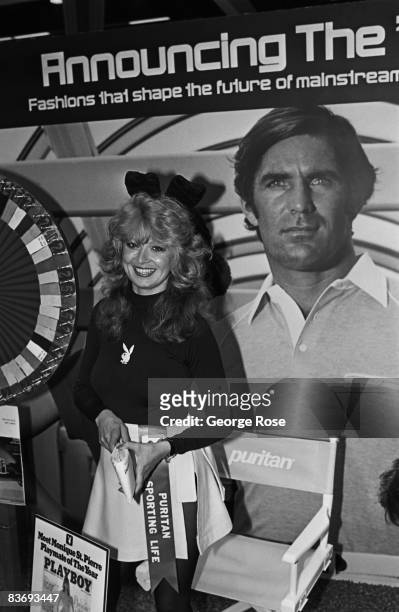 Playboy magazine's 1979 Playmate of the Year, Monique St. Pierre, poses at a promotional booth in this 1980 Los Angeles, California, photo taken at...