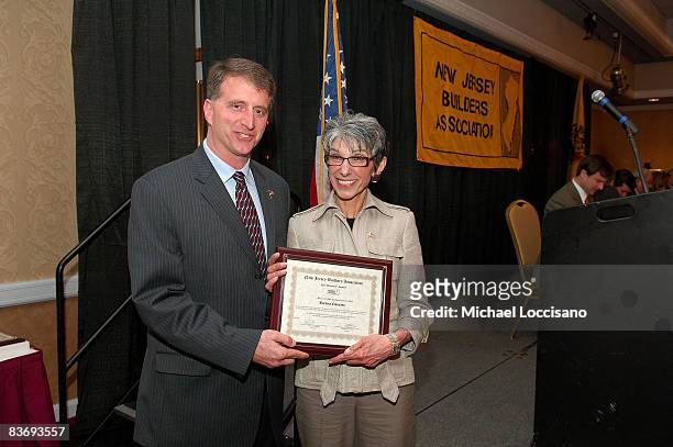 Thomas Critelli presents Barbara Chiusano with an award during the 2008 Atlantic Builders Convention NJBA Board of Directors luncheon at the Taj...