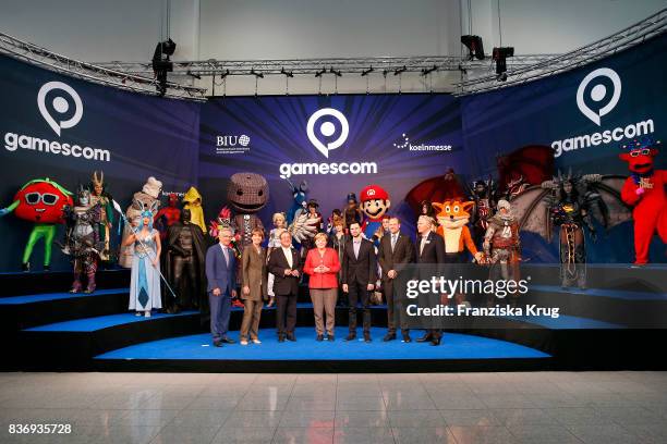 Sean Casey, Henriette Reker, Armin Laschet, Felix Falk, Tobias Haar and Gerald Boese welcome German Chancellor Angela Merkel at the Gamescom 2017...