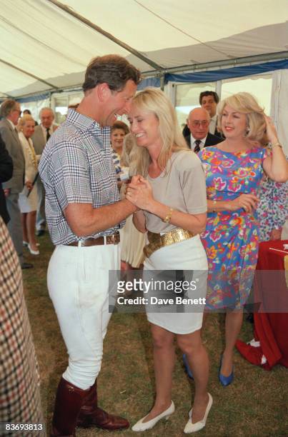 Prince Charles at a polo match in Windsor with actress Susan George and Lady 'Kanga' Tryon , 10th July 1991.