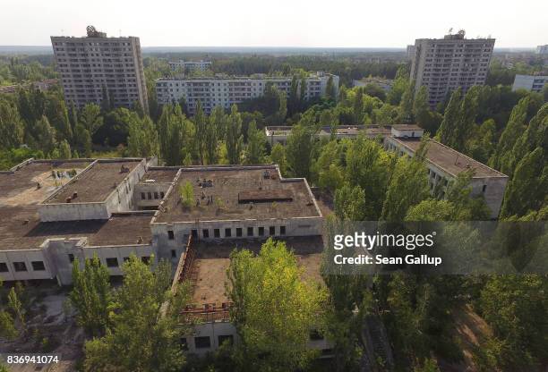 In this aerial view abandoned buildings stand near the main square in the ghost town of Pripyat not far from the Chernobyl nuclear power plant on...
