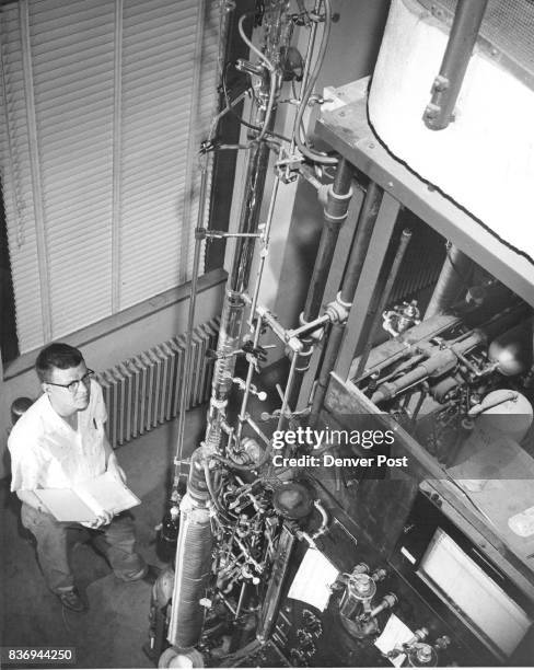 Sulphur Purifier Chemist Richard Johnson checks distillation column in sulphur purification project at the Wyoming station. Credit: Denver Post