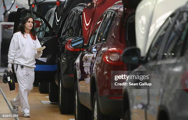 Female worker keeps track of VW Tiguan cars at the Volkswagen car factory on November 14, 2008 in Wolfsburg, Germany. Many European carmakers are...