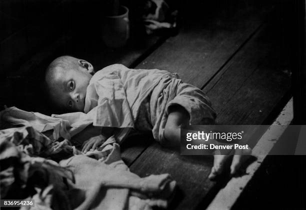 Vietnam * War Orphans Life For Him is Fragile A South Vietnamese war orphan lies unattended in the Bien Hoa orphanage north of Saigon typifying a...