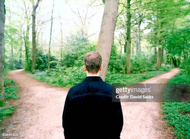 man at crossroads - choices stockfoto's en -beelden