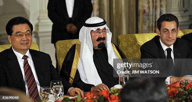 Saudi King Abdullah is seated with Chinese President Hu Jintao and French President Nicolas Sarkozy during a dinner at the White House hosted by US...