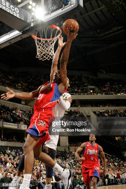 Thaddeus Young of the Philadelphia 76ers drives past Danny Granger of the Indiana Pacers at Conseco Fieldhouse on November 14, 2008 in Indianapolis,...