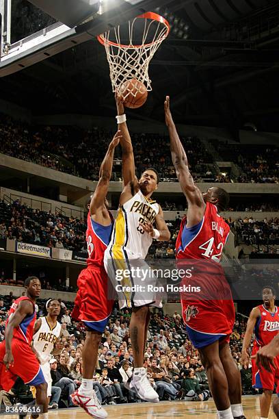 Brandon Rush of the Indiana Pacers shoots over Elton Brand of the Philadelphia 76ers at Conseco Fieldhouse on November 14, 2008 in Indianapolis,...