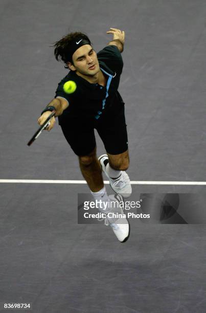 Roger Federer of Switzerland returns a shot during his round robin match against Andy Murray of Great Britain in the Tennis Masters Cup held at Qi...