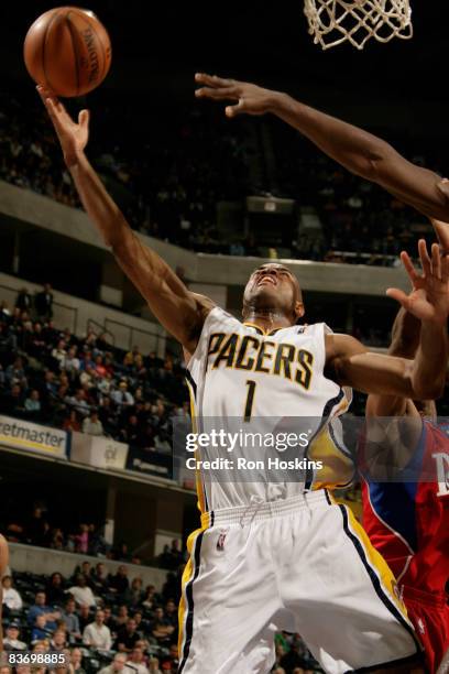 Jarrett Jack of the Indiana Pacers shoots over a Philadelphia 76ers defender at Conseco Fieldhouse on November 14, 2008 in Indianapolis, Indiana. The...