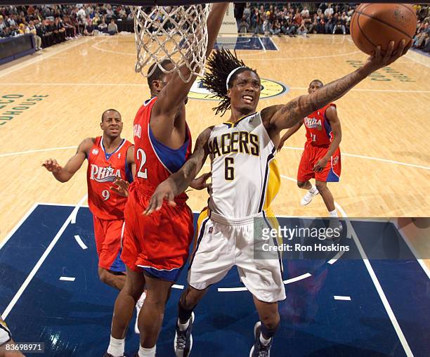 Marquis Daniels of the Indiana Pacers shoots over Elton Brand of the Philadelphia 76ers at Conseco Fieldhouse on November 14, 2008 in Indianapolis,...