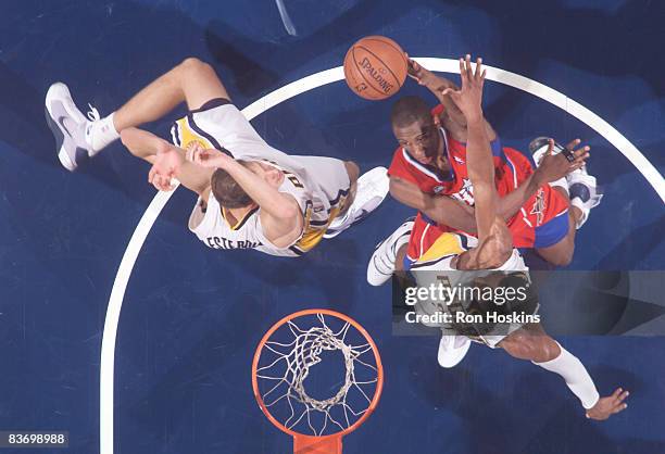 Thaddeus Young of the Philadelphia 76ers battles Danny Graner and Rasho Nesterovic of the Indiana Pacers at Conseco Fieldhouse on November 14, 2008...