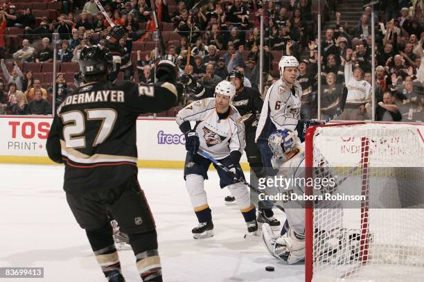 Greg de Vries, Dan Ellis and Shea Weber of the Nashville Predators defends a goal made from Chris Kunitz of the Anaheim Ducks during the game on...
