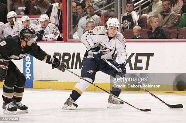 Kevin Klein of the Nashville Predators drives the puck as Teemu Selanne of the Anaheim Ducks reaches in during the game on November 14, 2008 at Honda...