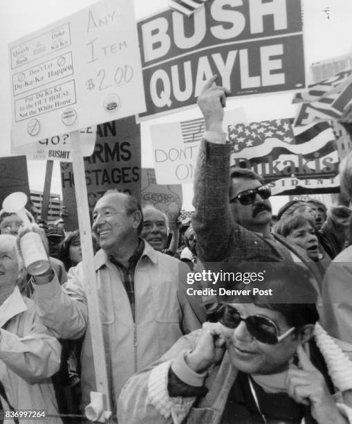 Bush in Denver Supporters and Protesters in the same Crowd Left to right: Jean Savoie Horace Savoie, holding a freon air horn to cover-up the voices...