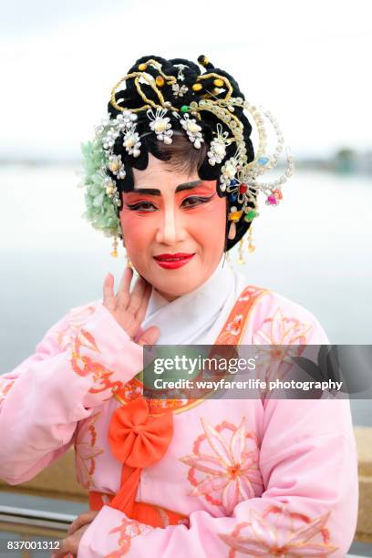 a portrait of chinese opera performer looking at the camera - chinese opera in thailand stock pictures, royalty-free photos & images
