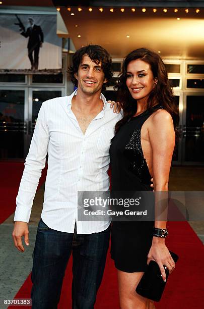 Radio host Andy Lee and model Megan Gale arrive for the Australian premiere of 'Quantum of Solace' at the Hoyts Cinema in the Entertainment Quarter...