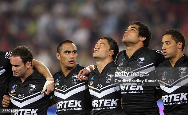 The Kiwis embrace during the national anthem before the 2008 Rugby League World Cup Semi Final match between England and the New Zealand Kiwis at...