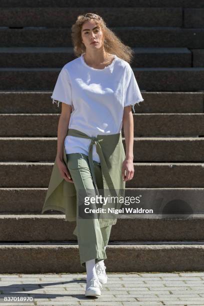 Model walks the runway at the IBEN show during the Fashion Week Oslo Spring/Summer 2018 at the Deichmanske Bibliotek on August 22, 2017 in Oslo,...