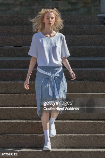 Model walks the runway at the IBEN show during the Fashion Week Oslo Spring/Summer 2018 at the Deichmanske Bibliotek on August 22, 2017 in Oslo,...