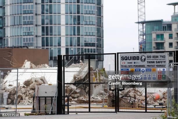 Demolition works takes place at the Nine Elms Square construction site in London, U.K., on Tuesday, Aug. 22, 2017. Billionaire Wang Jianlins Dalian...