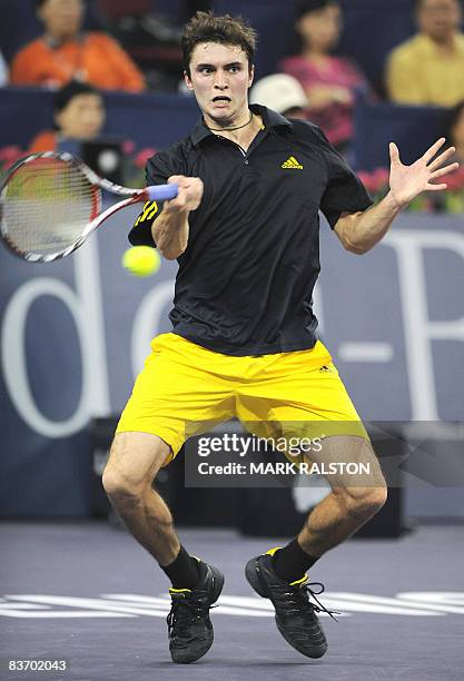 Gilles Simon of France hits a return against Novak Djokovic of Serbia during their men's singles semi-final match on the seventh day of the ATP...