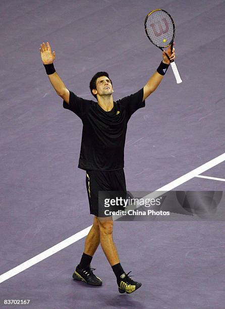 Novak Djokovic of Serbia celebrates winning his semi-final match against Gilles Simon of France in the Tennis Masters Cup held at Qin Zhong Stadium...
