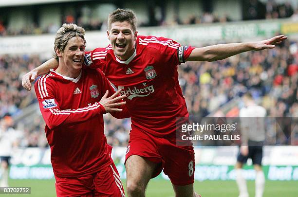 Liverpool's English midfielder Steven Gerrard celebrates with Spanish forward Fernando Torres after scoring against Bolton Wanderers during their...