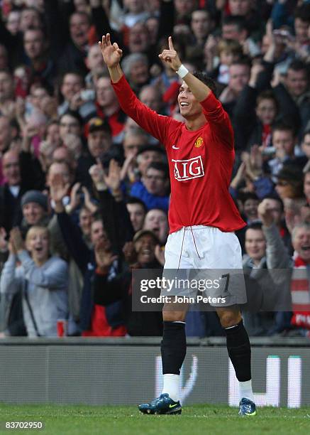 Cristiano Ronaldo of Manchester United celebrates scoring their first goal during the Barclays Premier League match between Manchester United and...