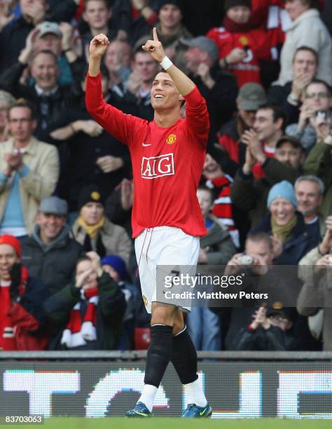 Cristiano Ronaldo of Manchester United celebrates scoring their first goal during the Barclays Premier League match between Manchester United and...