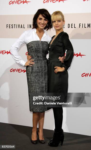 Actresses Caterina Murino and Mena Suvari attends the 'The Garden Of Eden' photocall during the 3rd Rome International Film Festival held at the...