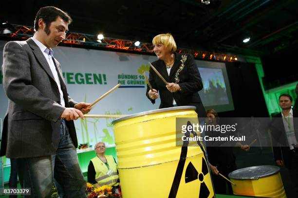 Just elected Chairmen Cem Oezdemir and Claudia Roth drum on a barrel after their election on the German Greens Party annual national congress on...