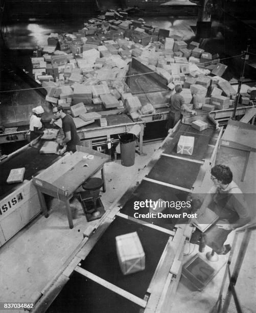 Parcels are sorted according to Zip codes at the Postal Service's Bulk Mail Center,, where volume is expected to double during December. The BMC...