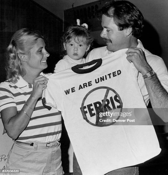 Denvention complex "United Airlines Pilots hold Solidarity Rally. Here Holding up a New strike T-Shirt are L to R Carol Hanson, Katie Hanson, Eric...
