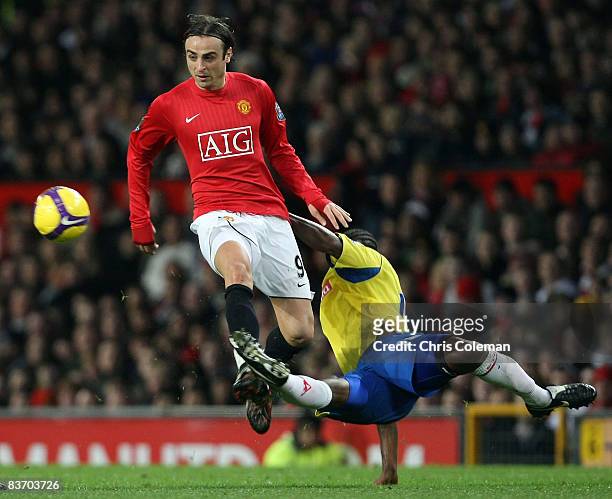 Dimitar Berbatov of Manchester United clashes with Salif Diao of Stoke City during the Barclays Premier League match between Manchester United and...