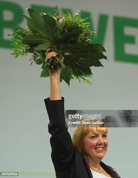 Claudia Roth holds up flowers after her re-election as Chairwoman of the German Greens Party at the annual party congress on November 15, 2008 in...
