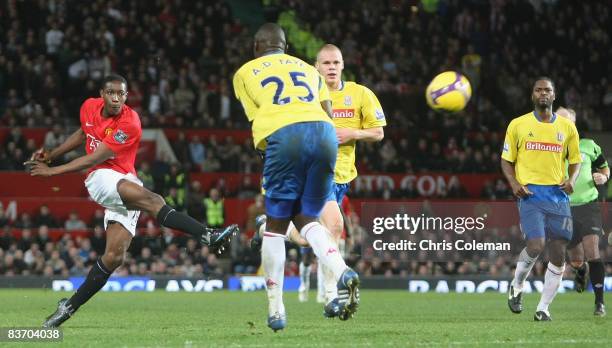 Danny Welbeck of Manchester United scores their fourth goal during the Barclays Premier League match between Manchester United and Stoke City at Old...