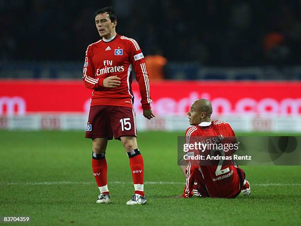 Piotr Trochowski and Alex Silva of Hamburg react during the Bundesliga match between Hertha BSC Berlin and Hamburger SV at the Olympic stadium on...