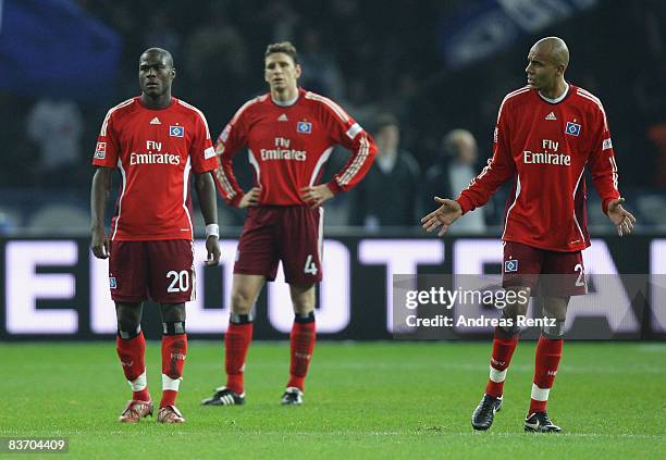 Guy Demel, Bastian Reinhardt and Alex Silva of Hamburg react during the Bundesliga match between Hertha BSC Berlin and Hamburger SV at the Olympic...