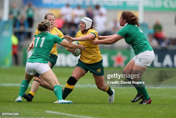 Sharni Williams of Australia is tackled by Alison Miller and Ailis Egan during the Women's Rugby World Cup 2017 match between Ireland and Australia...