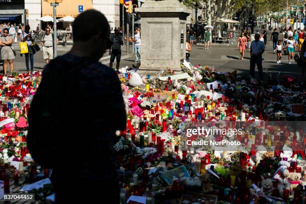 People display flowers, candles, balloons and many objects to pay tribute to the victims of the Barcelona and Cambrils attacks on the Rambla...